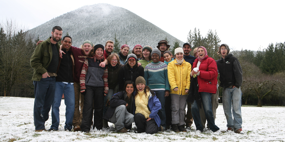 Large group of smiling Corps Members standing in the snow. 