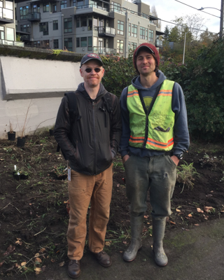 Chad Freeman of Adobe, a frequent EarthCorps volunteer and Project Manager, Matt Schwartz, smiling and standing together.